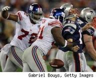 justin tuck forces a Brady to fumble!