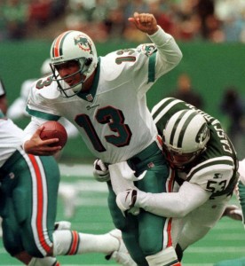 Jets linebacker Chad Cascadden wraps up Miami's Dan Marino for a sack.