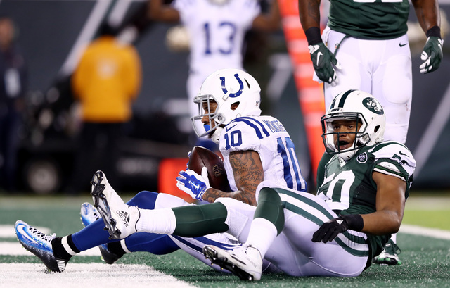 EAST RUTHERFORD, NJ - DECEMBER 05:  Donte Moncrief #10 of the Indianapolis Colts completes a reception for a touchdown in the third quarter as Darron Lee #50 of the New York Jets defends during their game at MetLife Stadium on December 5, 2016 in East Rutherford, New Jersey.  (Photo by Elsa/Getty Images)