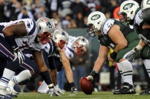 Nov 22, 2012; East Rutherford, NJ, USA; New York Jets center Nick Mangold (74) prepares to snap the ball at the line of scrimmage against the New England Patriots during the game on Thanksgiving at Metlife Stadium. The Patriots won the game 49-19. Mandatory Credit: Joe Camporeale-US PRESSWIRE